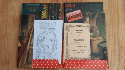 three books that are sitting on a table