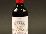 a bottle of wine that is sitting on a table