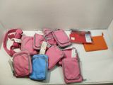 a lot of pink and blue bags sitting on a table