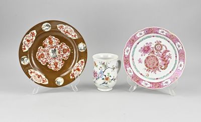two plates and a cup are sitting on a table