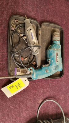 a box with a bunch of tools in it on the floor