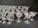 a lot of glasses that are sitting on a table