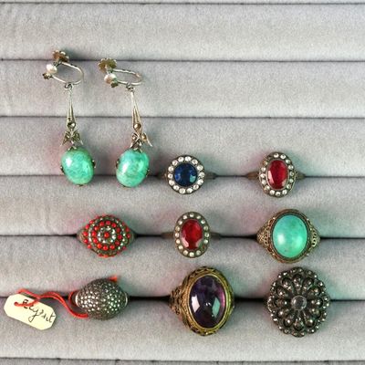 a close up of a bunch of jewelry on a table
