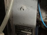 an image of a machine that has a hose attached to it