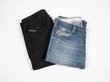two pairs of men ' s jeans on a white background