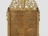 an old wooden box with a decorative design on top of it