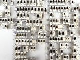 a picture of a wall of electrical equipment with lots of wires