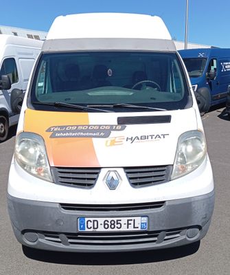 a white van that is parked in a parking lot
