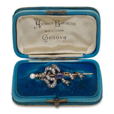 a blue case with a pair of earrings inside of it