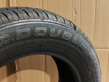 a close up of a tire on a cardboard box on a floor