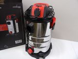 a vacuum that is sitting on a table next to a box