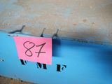 a blue box with a pink sticker attached to it