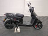 a scooter that is parked on a checkered floor