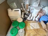 many items that are sitting on a shelf in the kitchen
