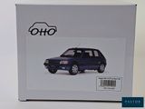 boxed box of a blue car with a sticker on the front