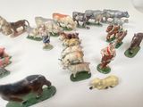 many figurines of animals that are on the table