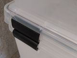 a large white box with a black handle on it