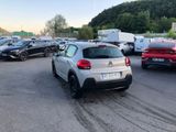 a lot of cars parked in a parking lot