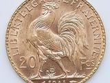 l'image d'une pièce d'or ornée d'un coq