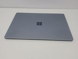 a laptop on a table with a white background
