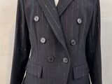 a suit on a mannequin stand with a mannequin leg