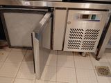 an image of a kitchen with a refrigerator and a dishwasher
