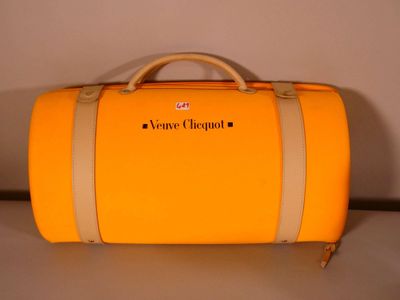 a yellow suitcase that is sitting on a table