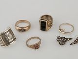 several different rings and rings on a white surface