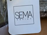 a label that says sema design on a piece of plastic