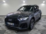 a grey audi suv parked on a checkered floor in a showroom