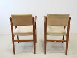 pair of mid century danish teak dining chairs with beige upholstered seats