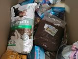 a cardboard box filled with dog food and other items