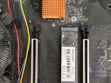 a close up of a computer motherboard with wires attached to it