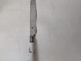 a knife that is laying on a table
