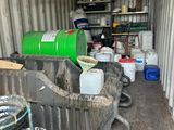 a container filled with buckets and other items inside of it