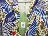 an image of a colorful shirt with a green tag on it