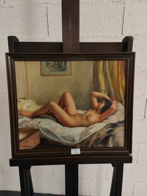 une peinture représentant une femme nue allongée sur un lit
