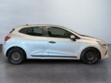 the white car is parked in a large room with a gray floor