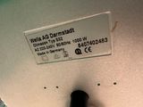 a label on the back of a laptop that says wella ag darmstadt