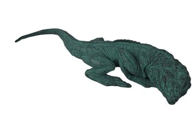 une image représentant une figurine de lézard vert sur fond blanc