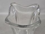 a glass vase that is sitting on a table