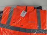 an orange safety vest sitting on top of a plastic bag
