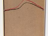 a picture of a piece of paper with a red string