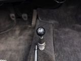 a close up of a car ' s gear lever in the center of the car