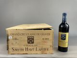 a wooden box with a bottle of wine next to it