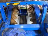 an image of a machine that is working on a piece of machinery