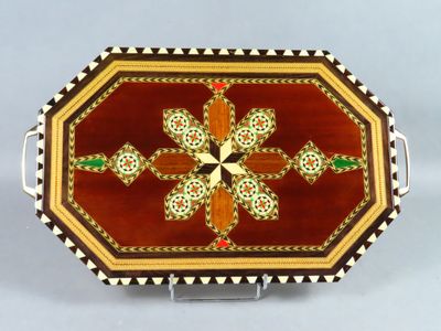an image of a decorative tray with a flower design on it
