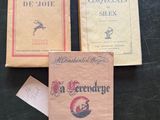 three books sitting on top of a table next to each other