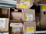 several boxes are stacked on top of each other on a shelf