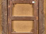 a close up of a wooden frame with a brown background